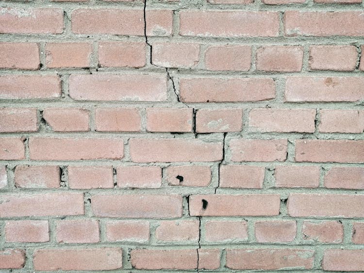 Close Up Of A Cracked Brick Wall