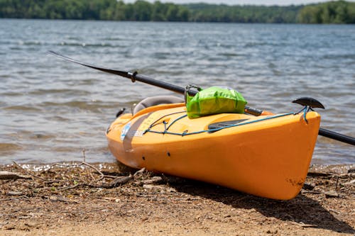 Free Yellow Kayak Near Body of Water Stock Photo