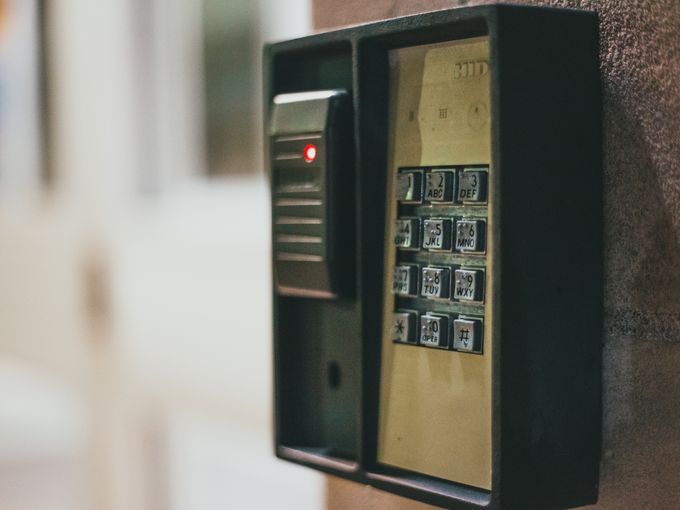 Access control keypad beside a door