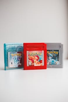 Close-up photo of classic Pokemon game cartridges in a studio setting.