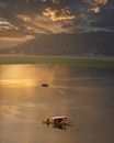 Two People Riding on Boat on Lake