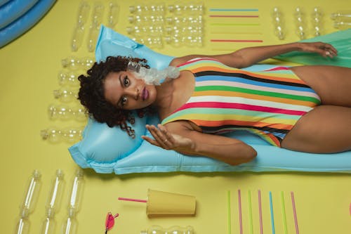 Woman Wearing a Swimsuit with Plastic on her Cheek