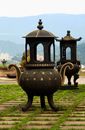 Brass and Black Ceramic Vase on Green Grass Field