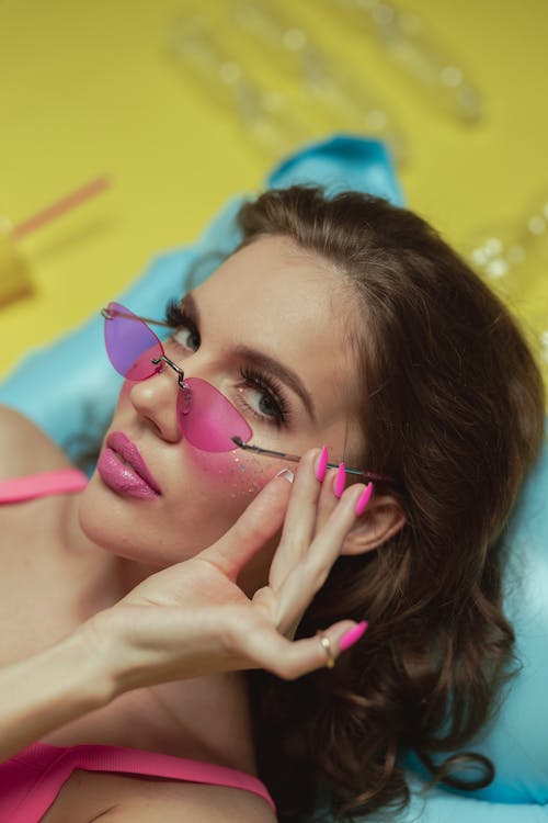 Woman in Pink Tank Top Wearing Sunglasses