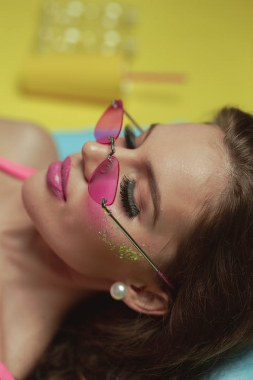 Woman With Pink Lipstick and Pearl Earrings