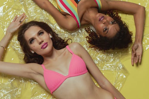 Women Wearing Swimsuit Lying on the Plastic