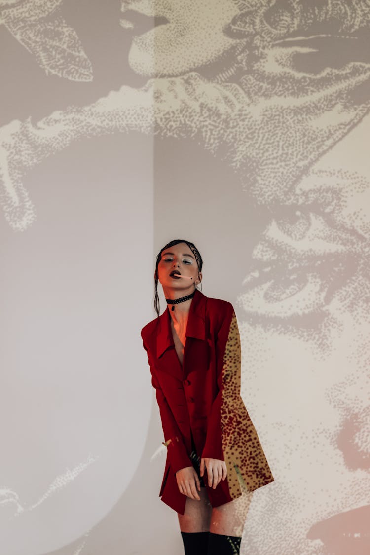 Woman With Cigarette In Studio With Multimedia Projection On Wall