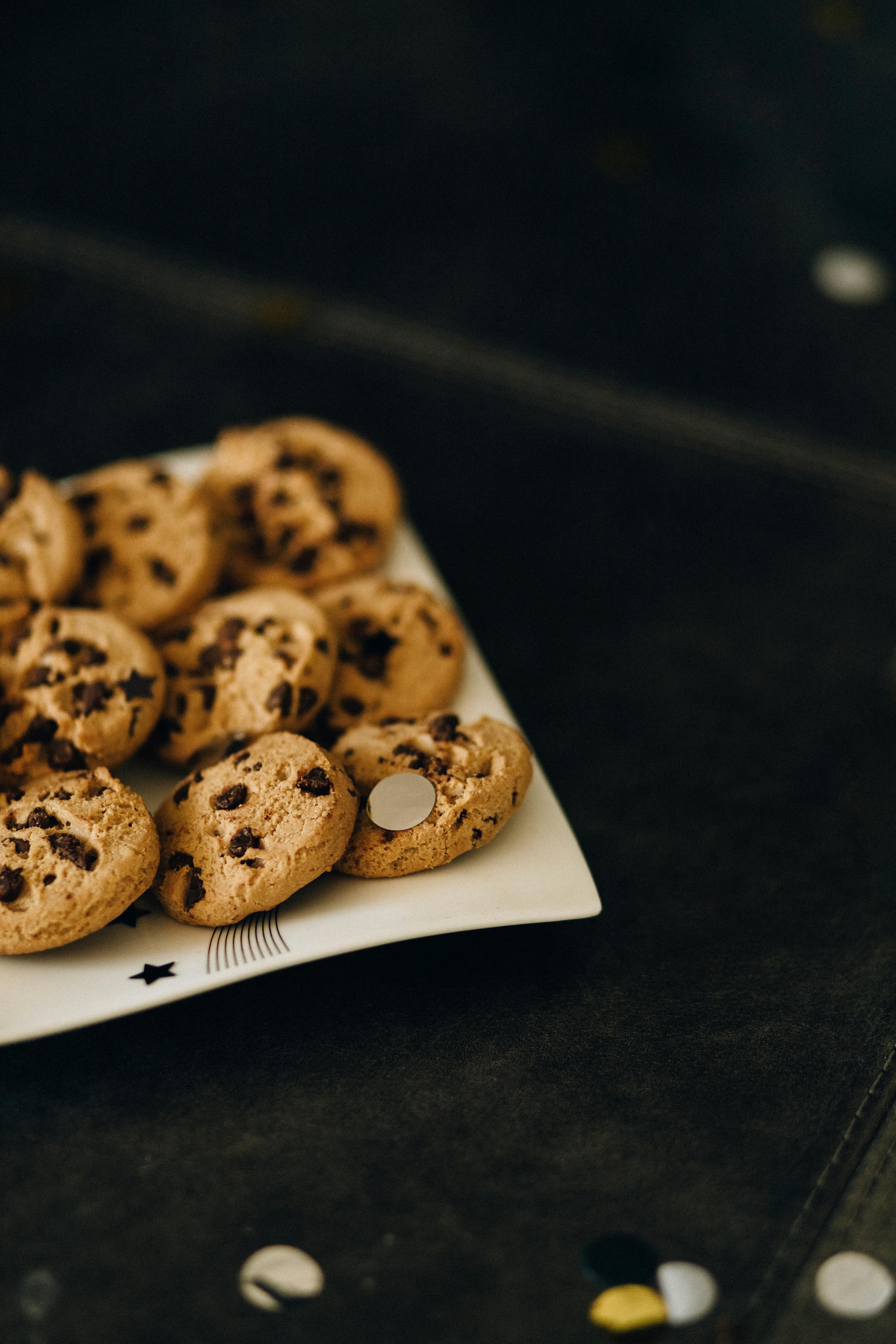Tasty chocolate chip cookies elegantly arranged on a decorative plate.