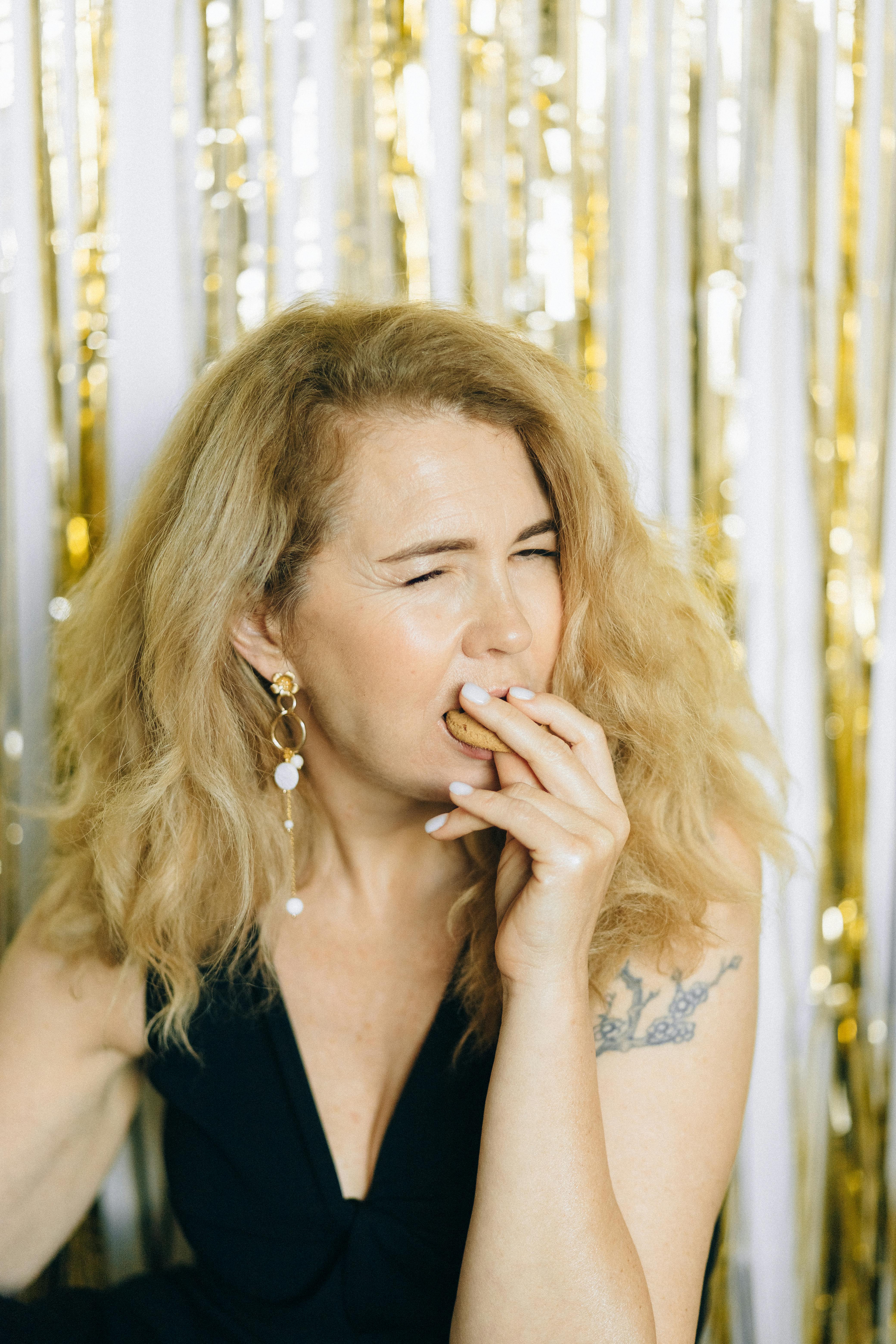 Woman Biting a Cookie · Free Stock Photo