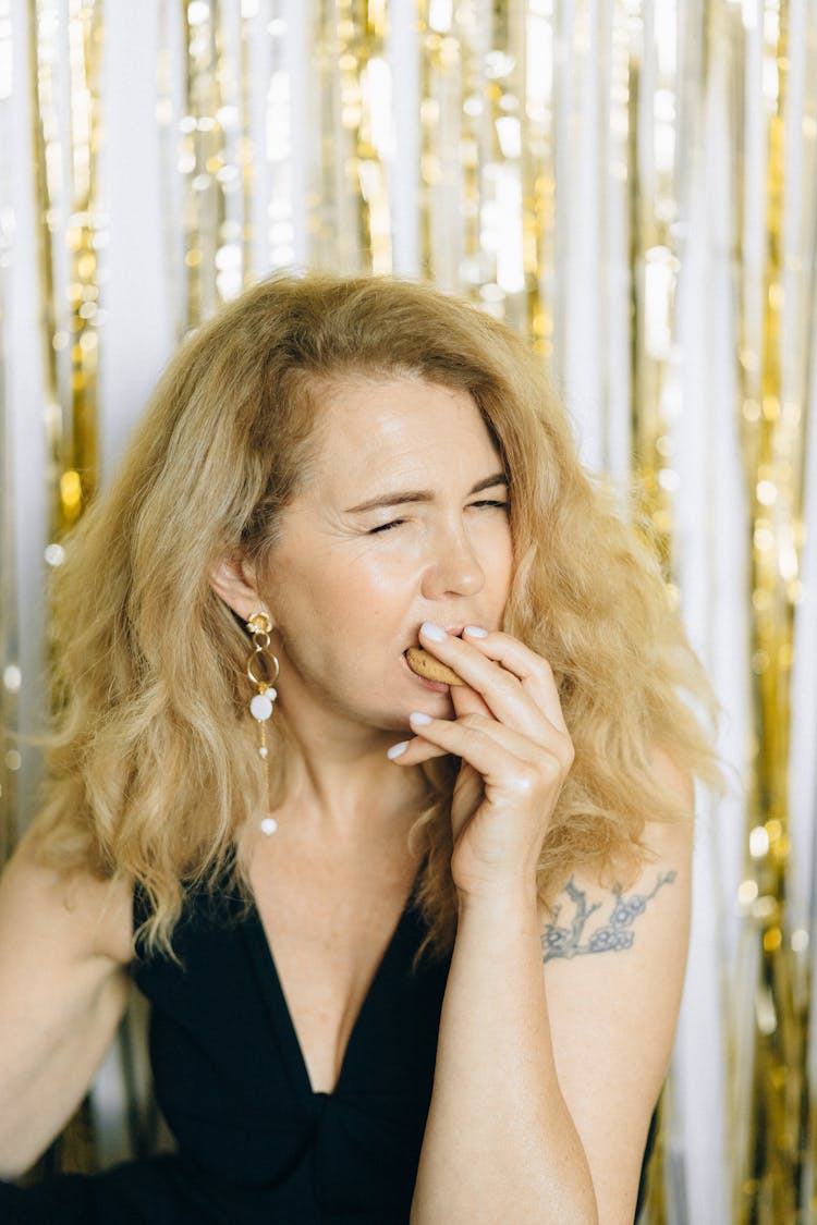 Woman Biting A Cookie