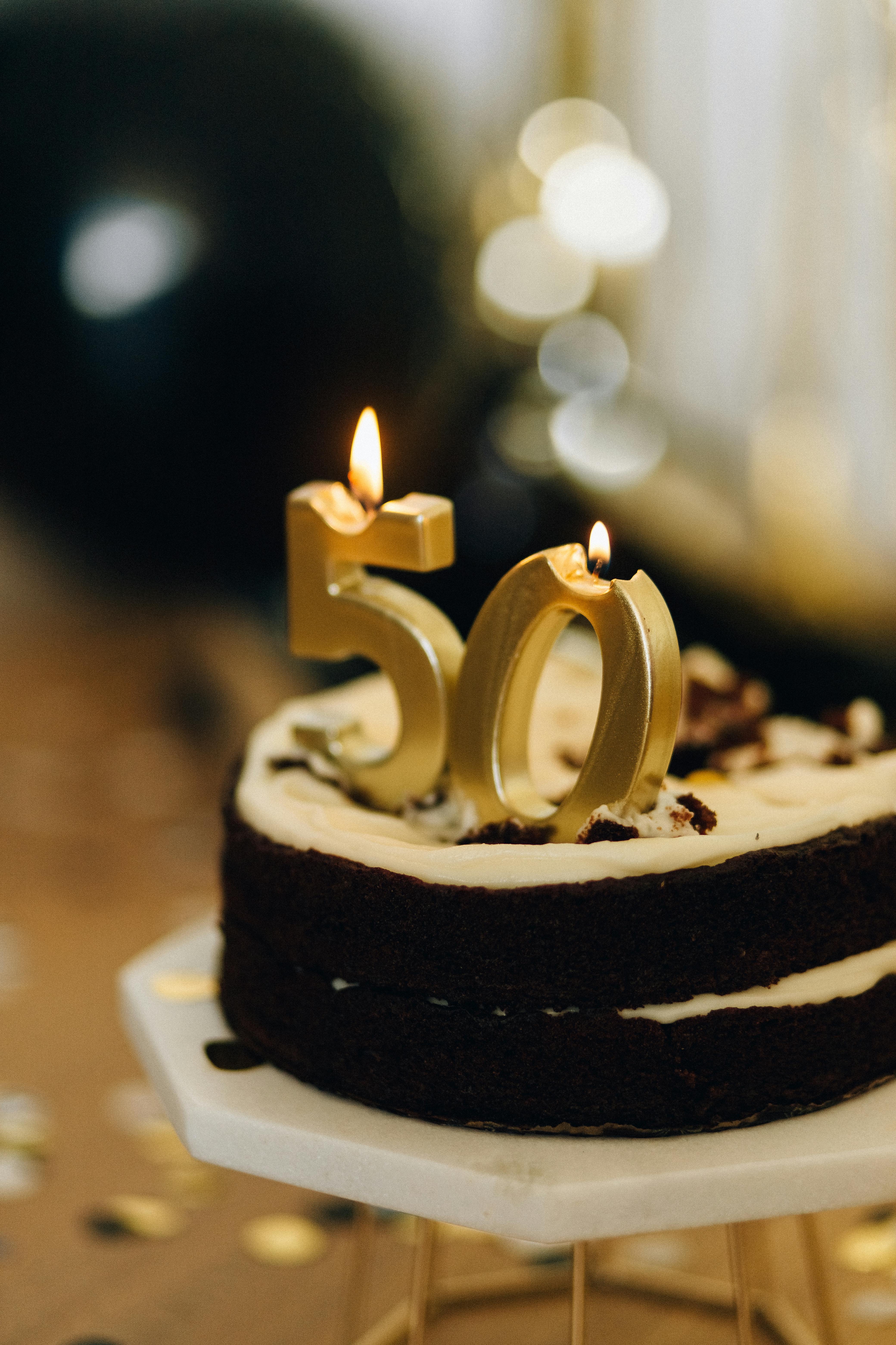 birthday cake with lighted candles on top