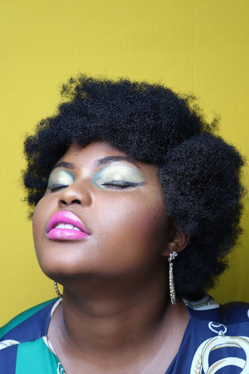 Close-Up Shot of an Afro-Haired Woman 