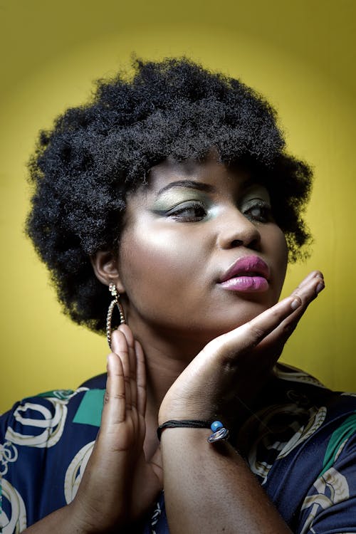 Close-Up Shot of an Afro-Haired Woman 