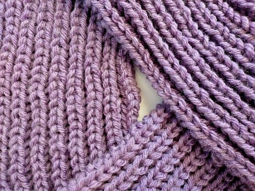 Close-Up Shot of a Purple Knit Textile