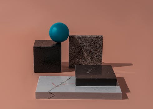 A striking minimalist still life of geometric shapes on a brown background.