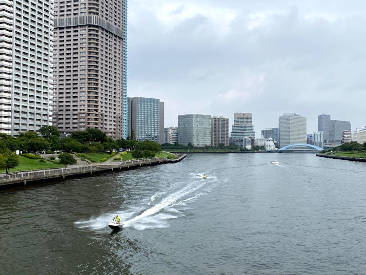 Motorboat Floating On The River In The City