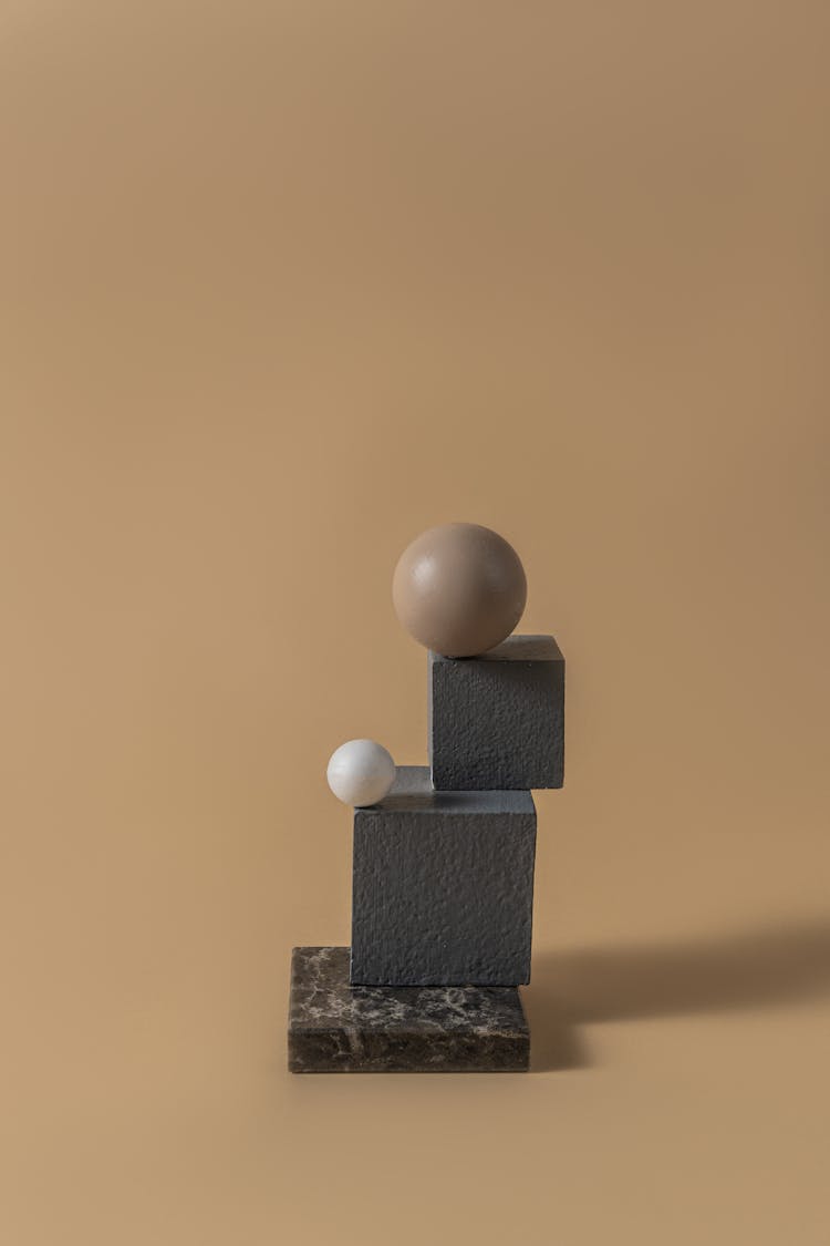 Stacks Of Cubes Beside Sphere Shape Ball 