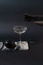 Clear Wine Glass on Black Table