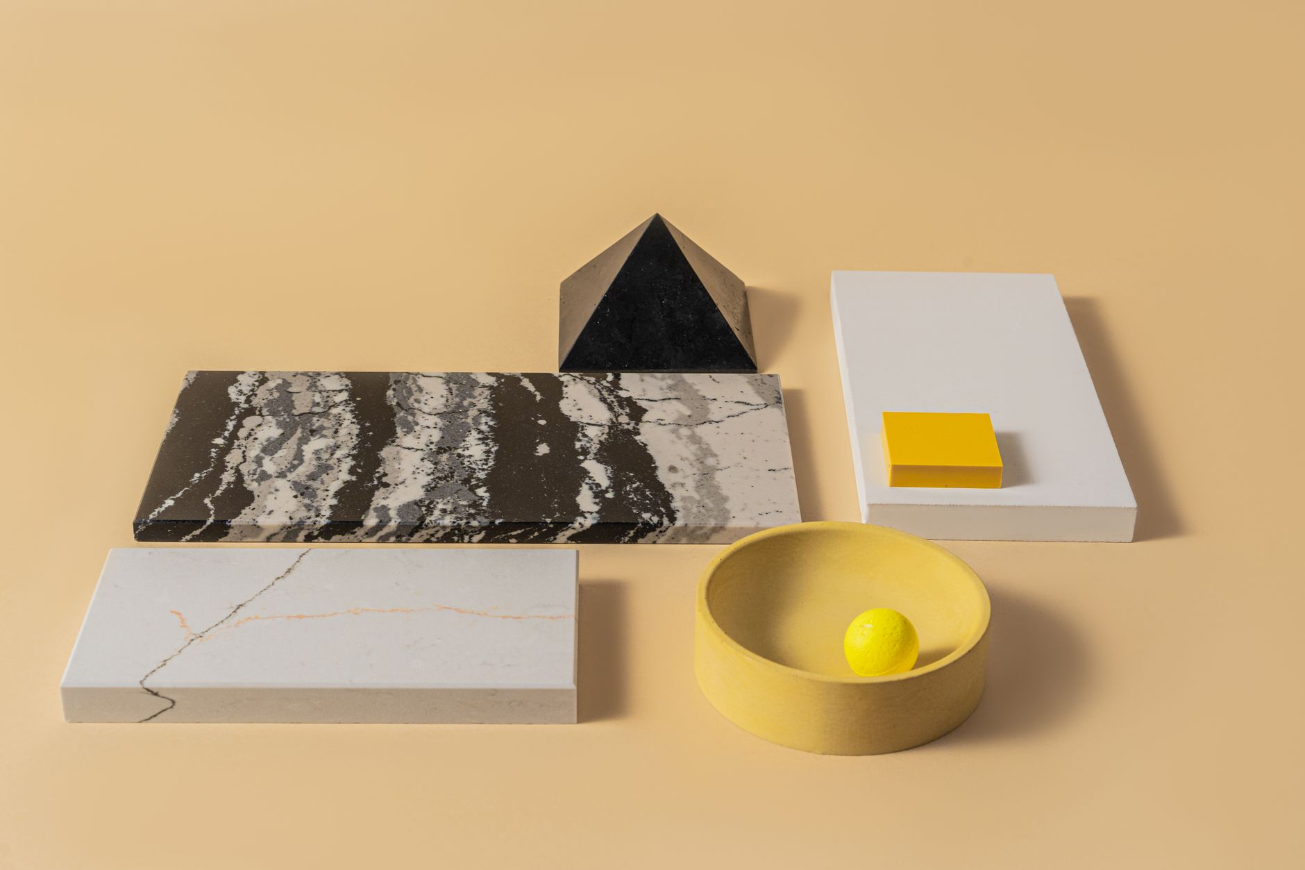 Bespoke luxury objects arranged on dark marble