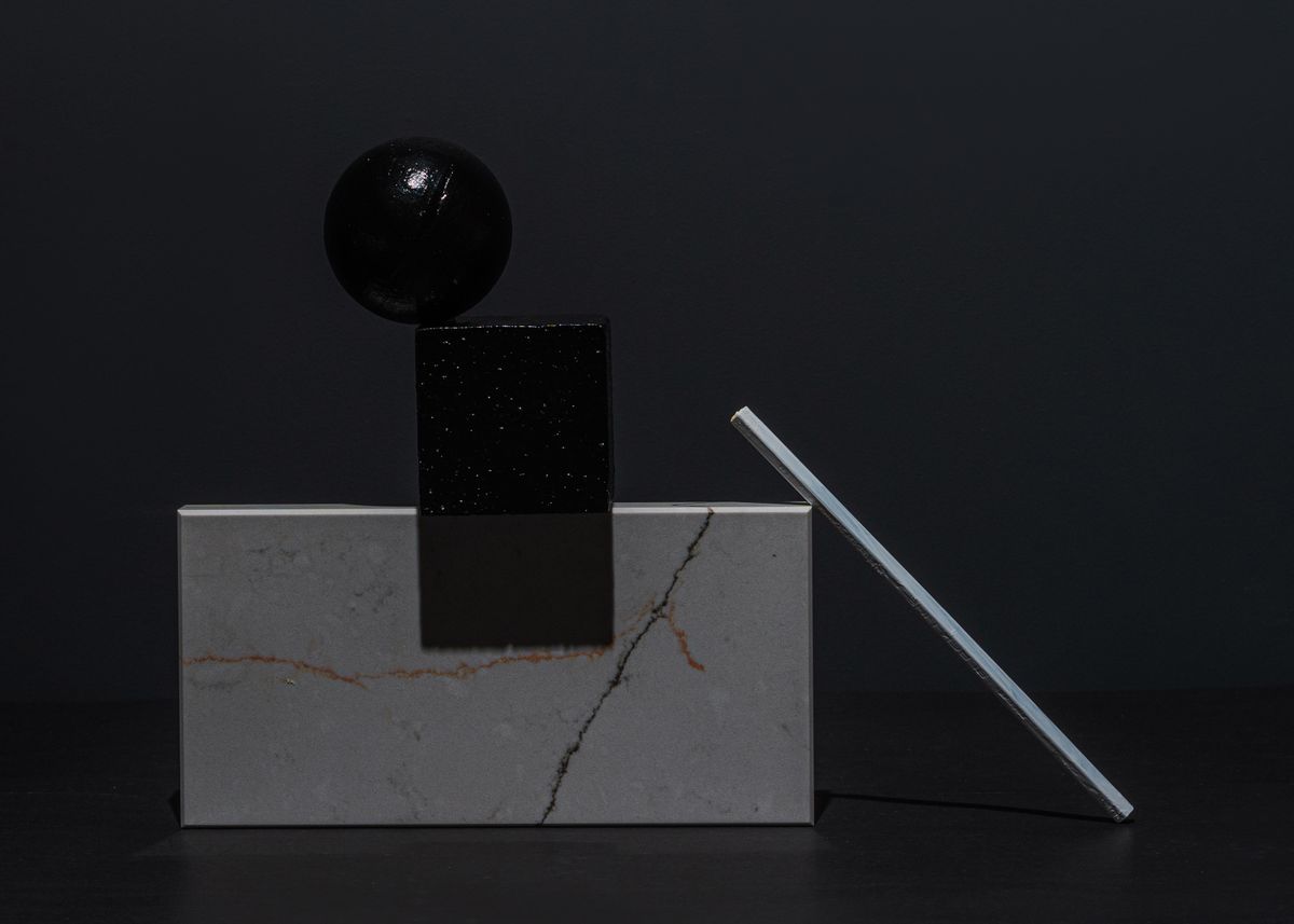 a glowing white marble on black velvet