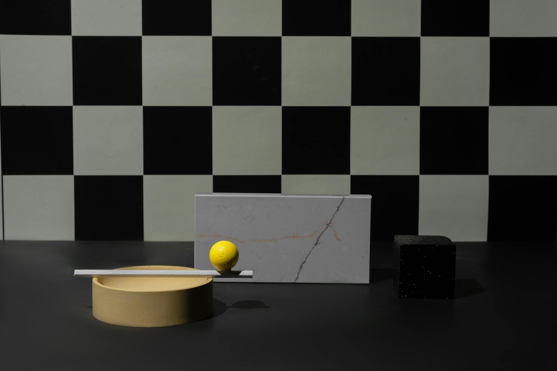 Geometric Shape Objects on a Black Surface