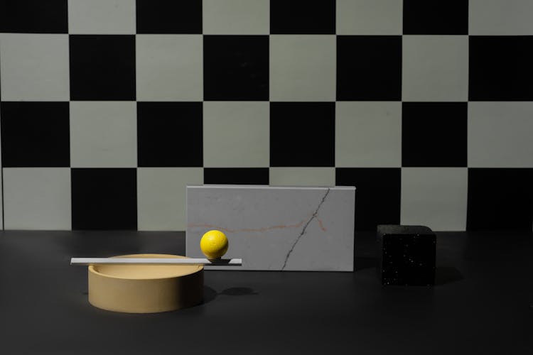 Geometric Shape Objects On A Black Surface