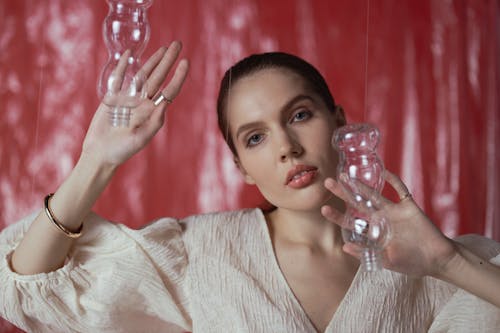Woman Touching the Plastic Bottles Decoration