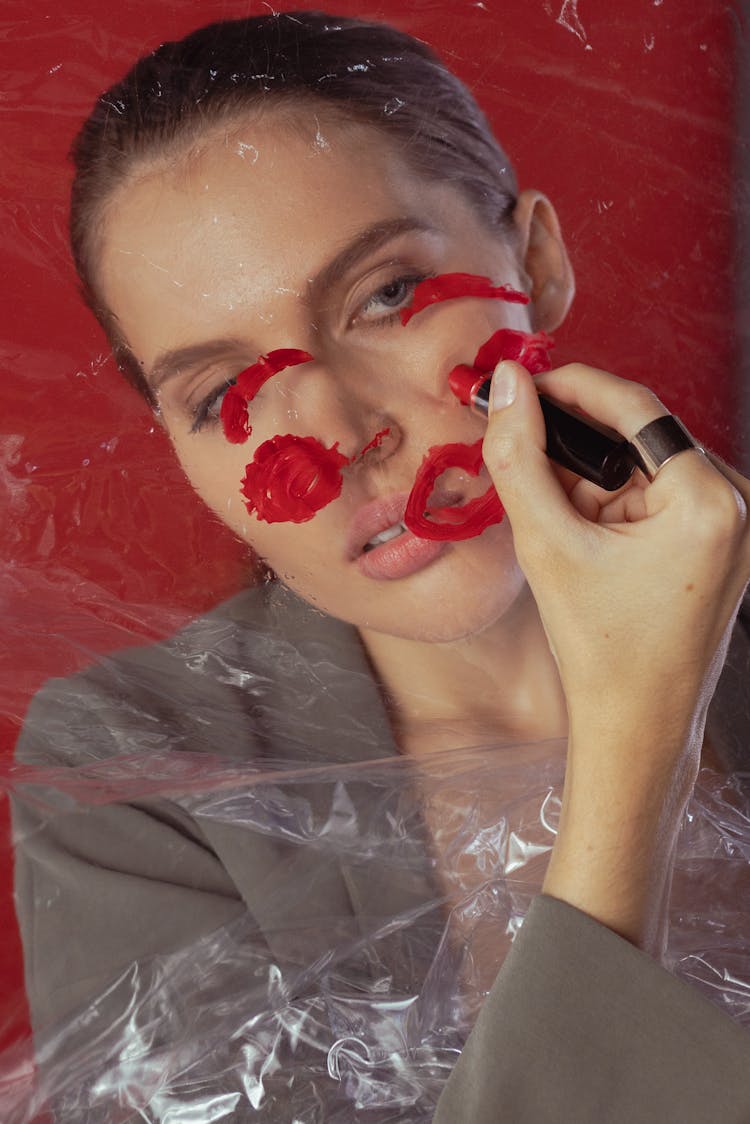 Woman With Red Lipstick On The Plastic