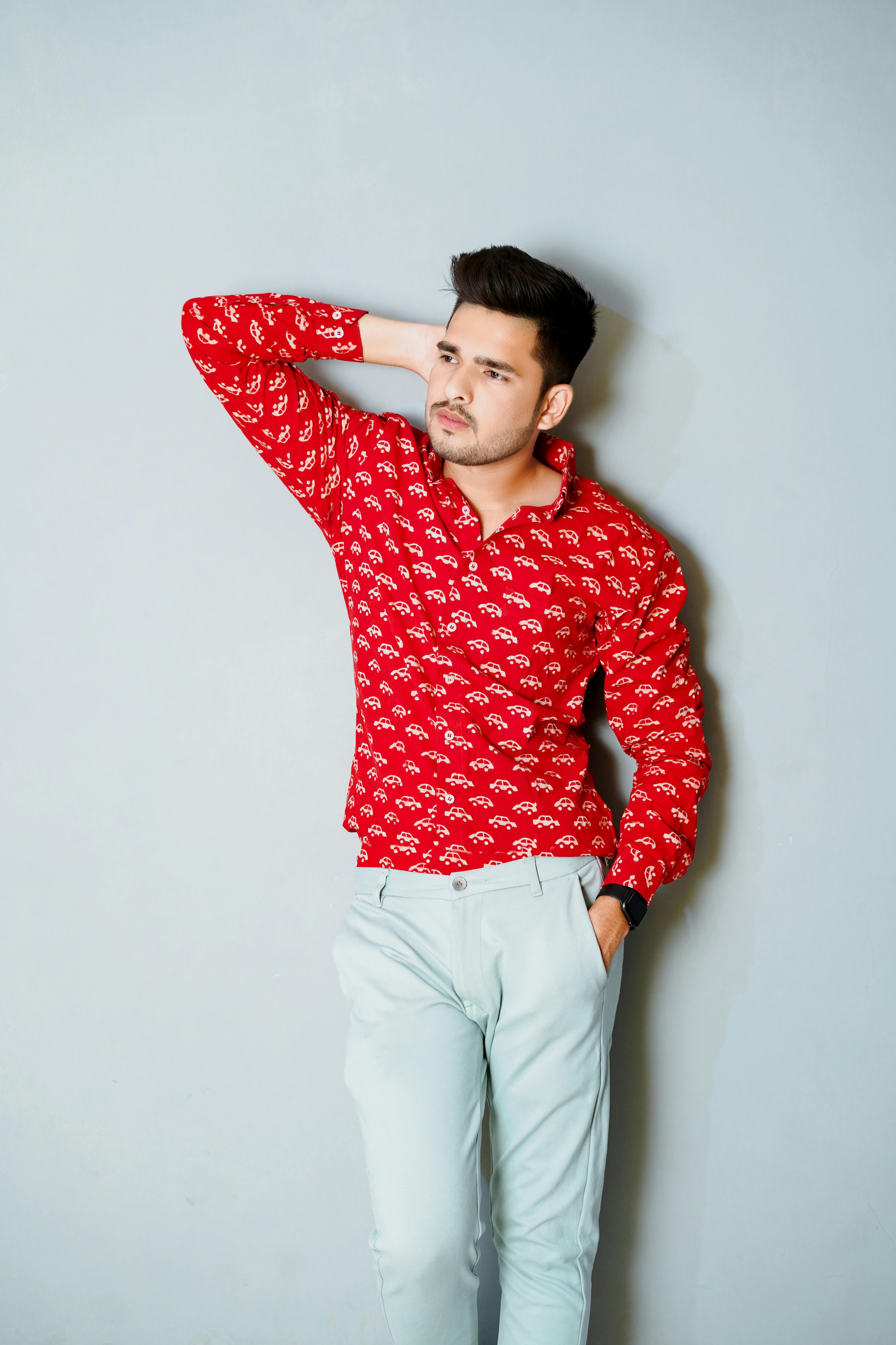 A man in a red shirt and white pants photo – Male Image on Unsplash