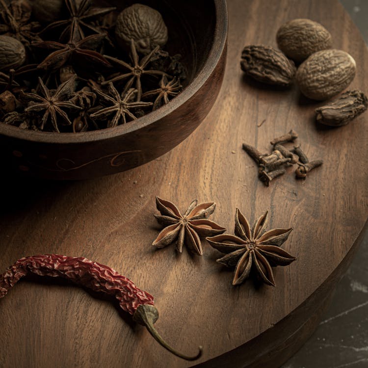 Dried Spices On A Wooden Board