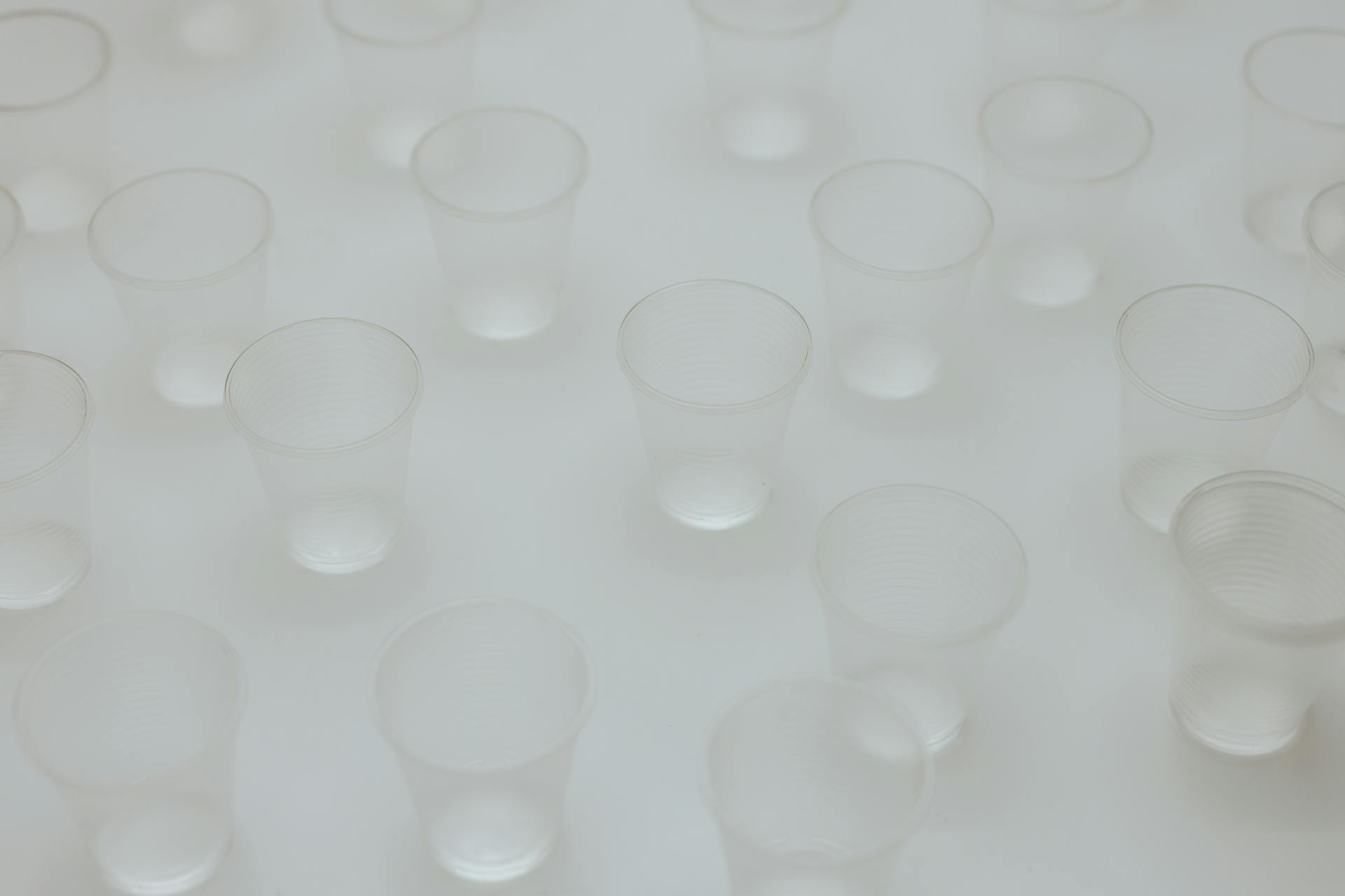 Clear Round Plastic Containers on White Surface
