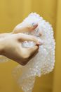 Persons Holding a Bubble Wrap