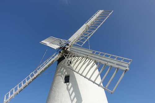 White Windmill Under Blue Sky