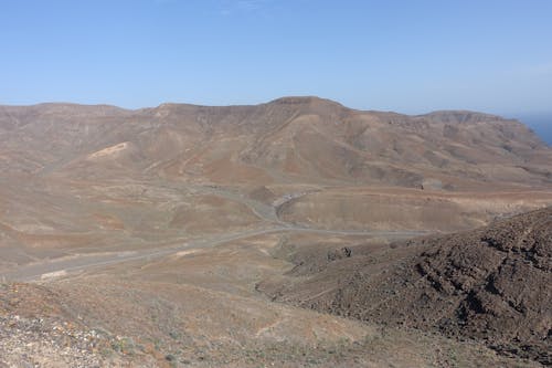 Brown Mountains Under Blue Sky