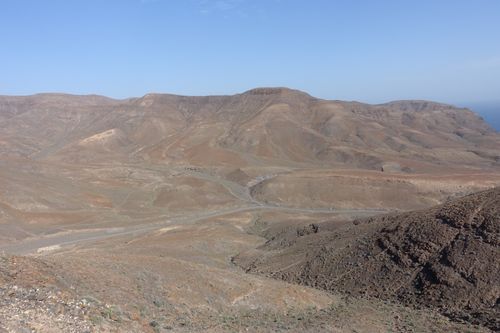 Free A stunning view of arid desert mountains under a clear blue sky, showcasing natural beauty. Stock Photo