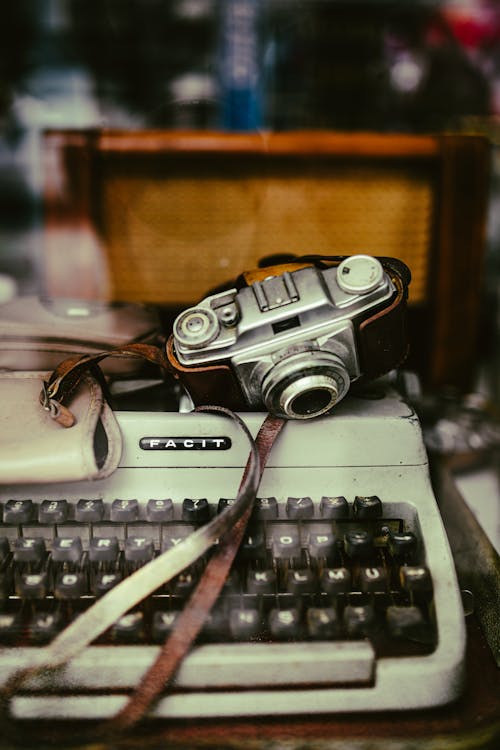 Close-Up Shot of Vintage Typewriter and Camera