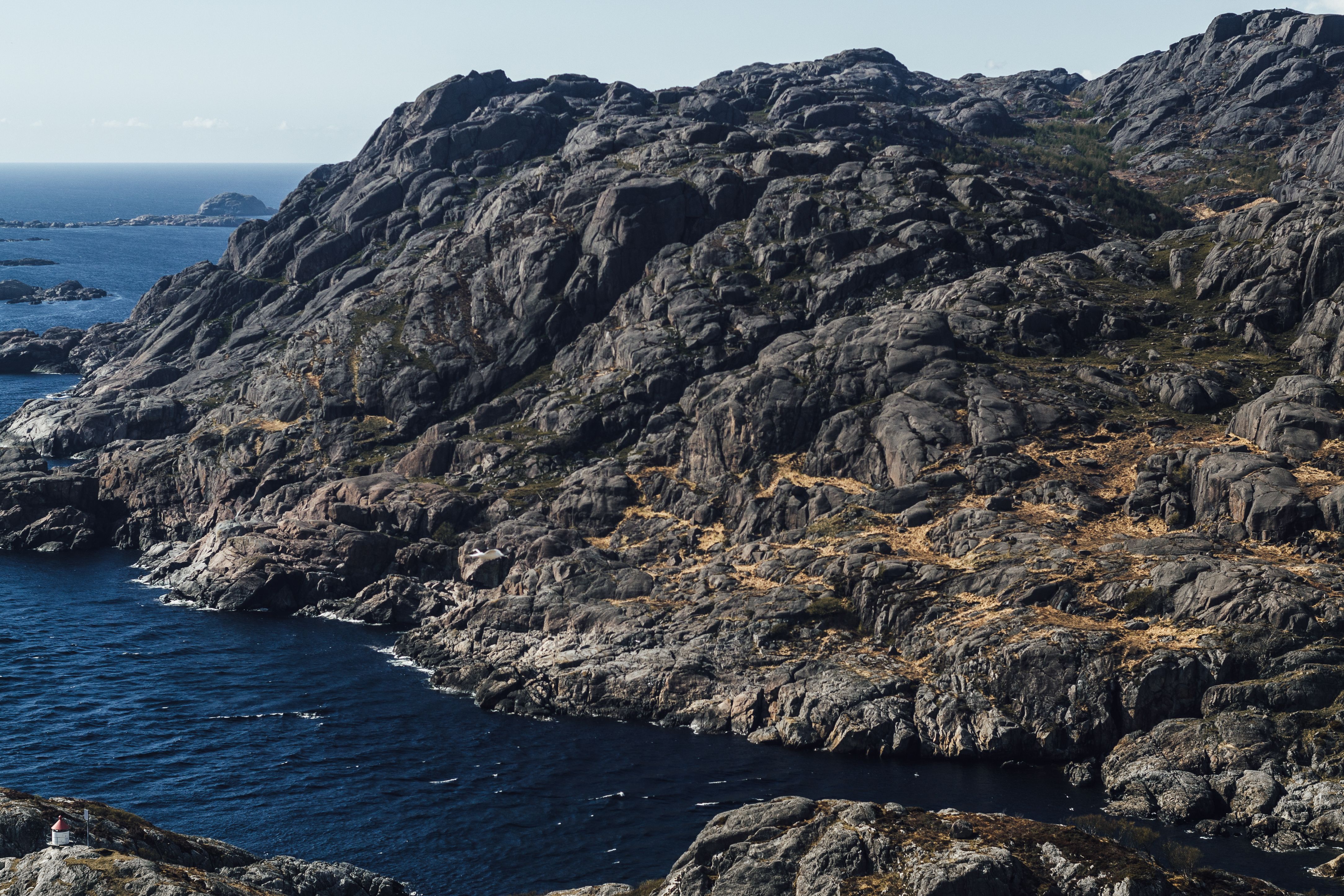 Stunning view of the rugged rocky coastline in Agder, Norway, with the North Sea in view.
