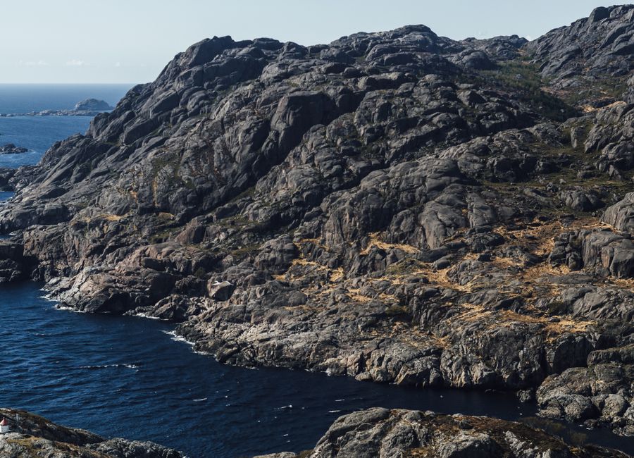 Stunning view of the rugged rocky coastline in Agder, Norway, with the North Sea in view.