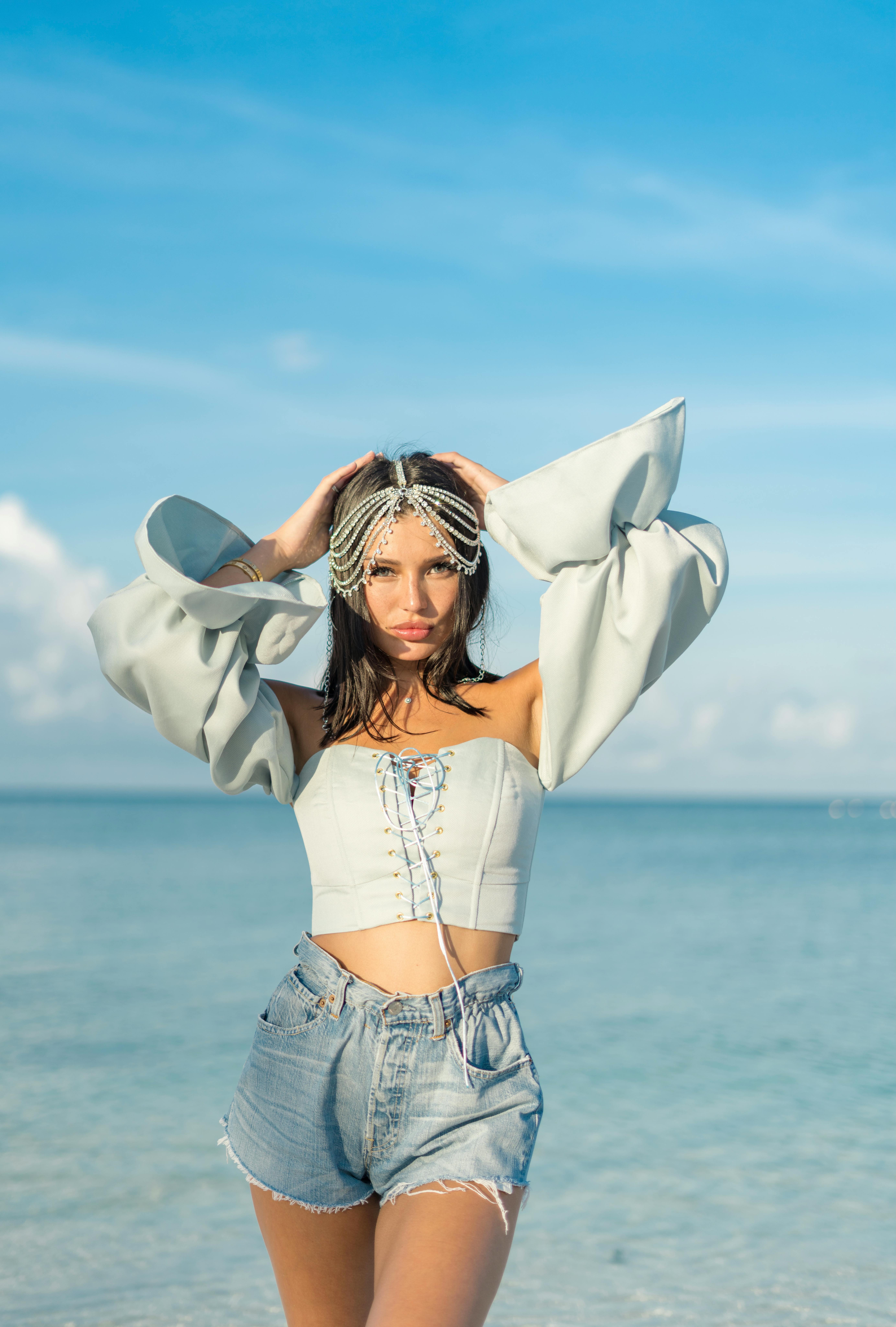 Free Confident woman with raised arms Stock Photo