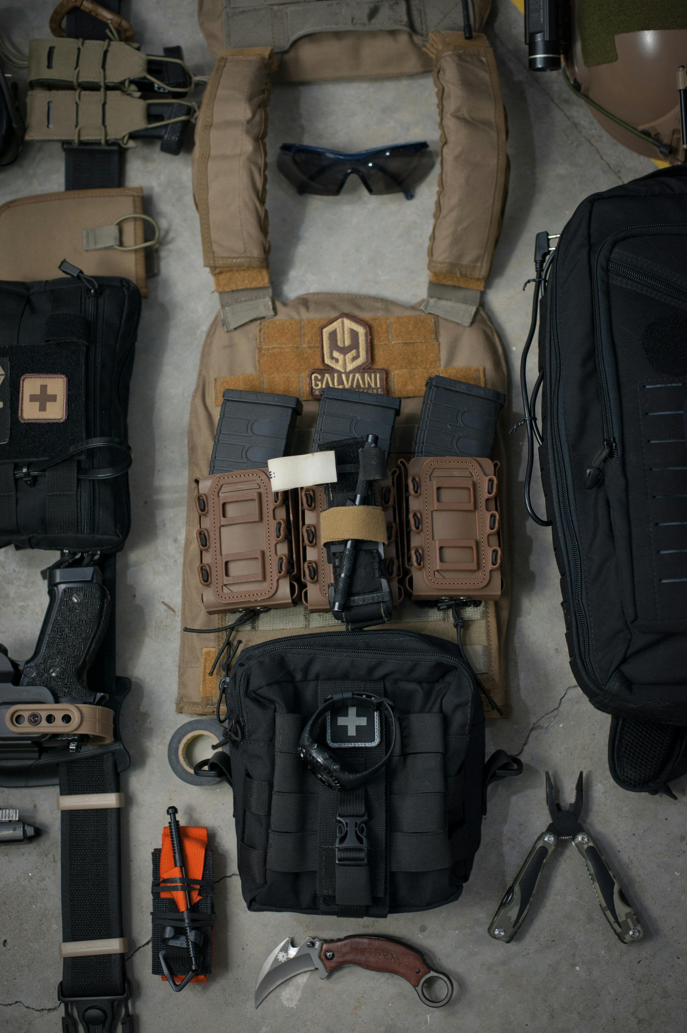 A U.S. Marine Corps Veteran preparing a work-specific bag with tools and safety gear, demonstrating situational everyday carry