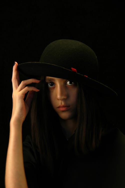 Close-Up Shot of a Pretty Woman with Black Hat