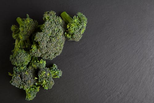 Free Close-Up Shot of Broccoli on a Gray Surface Stock Photo