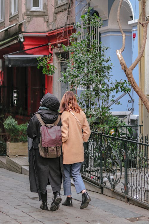 Two Women Walking on the Sidewalk 