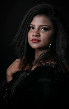 A stunning portrait of a woman with red lips, captured in a studio setting.