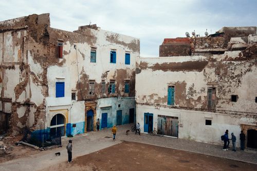Free Rustic buildings with blue doors in Essaouira, Morocco highlight cultural charm. Stock Photo