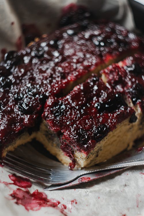 Selective Focus Photo of a Fork Beside a Slice of Blueberry Pie
