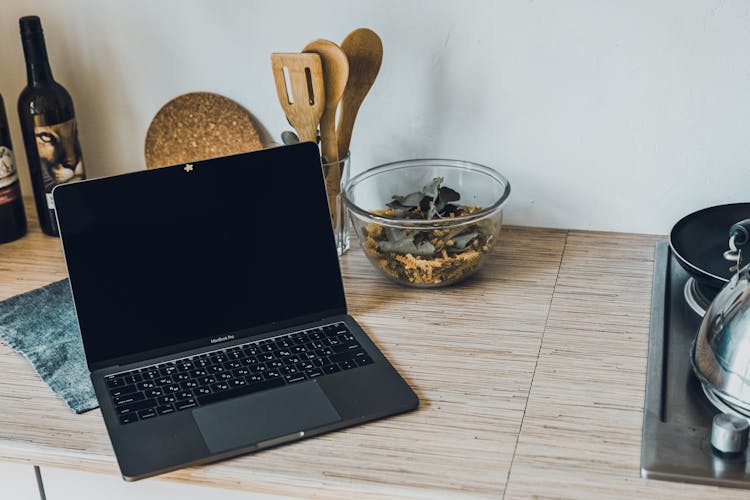 Laptop Standing On A Kitchen Counter 