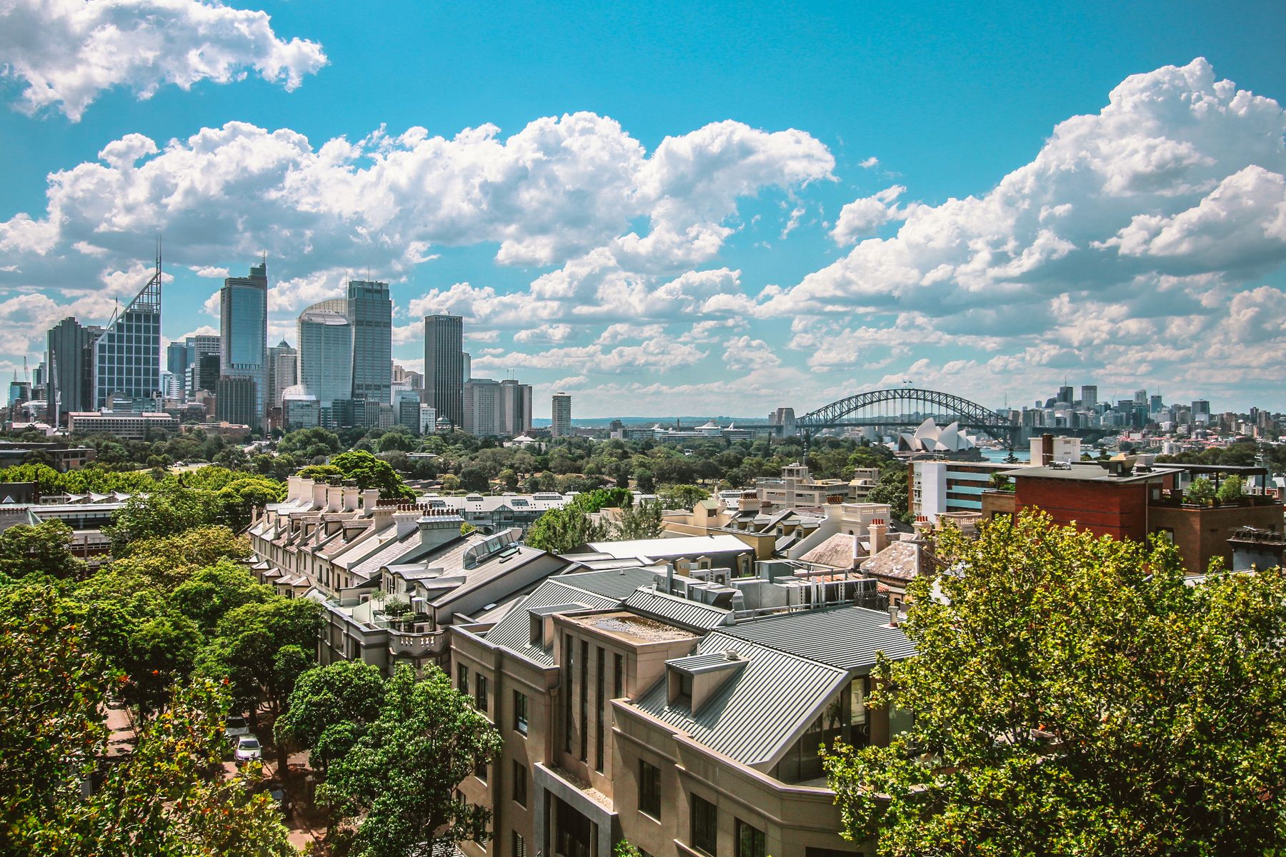 Wide aerial view across Sydney Harbour and the CBD