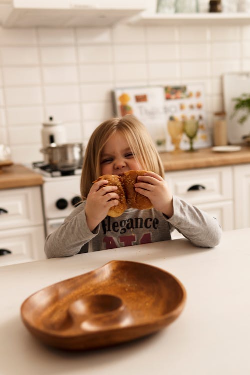 Free A Cute Girl Eating Breads Stock Photo