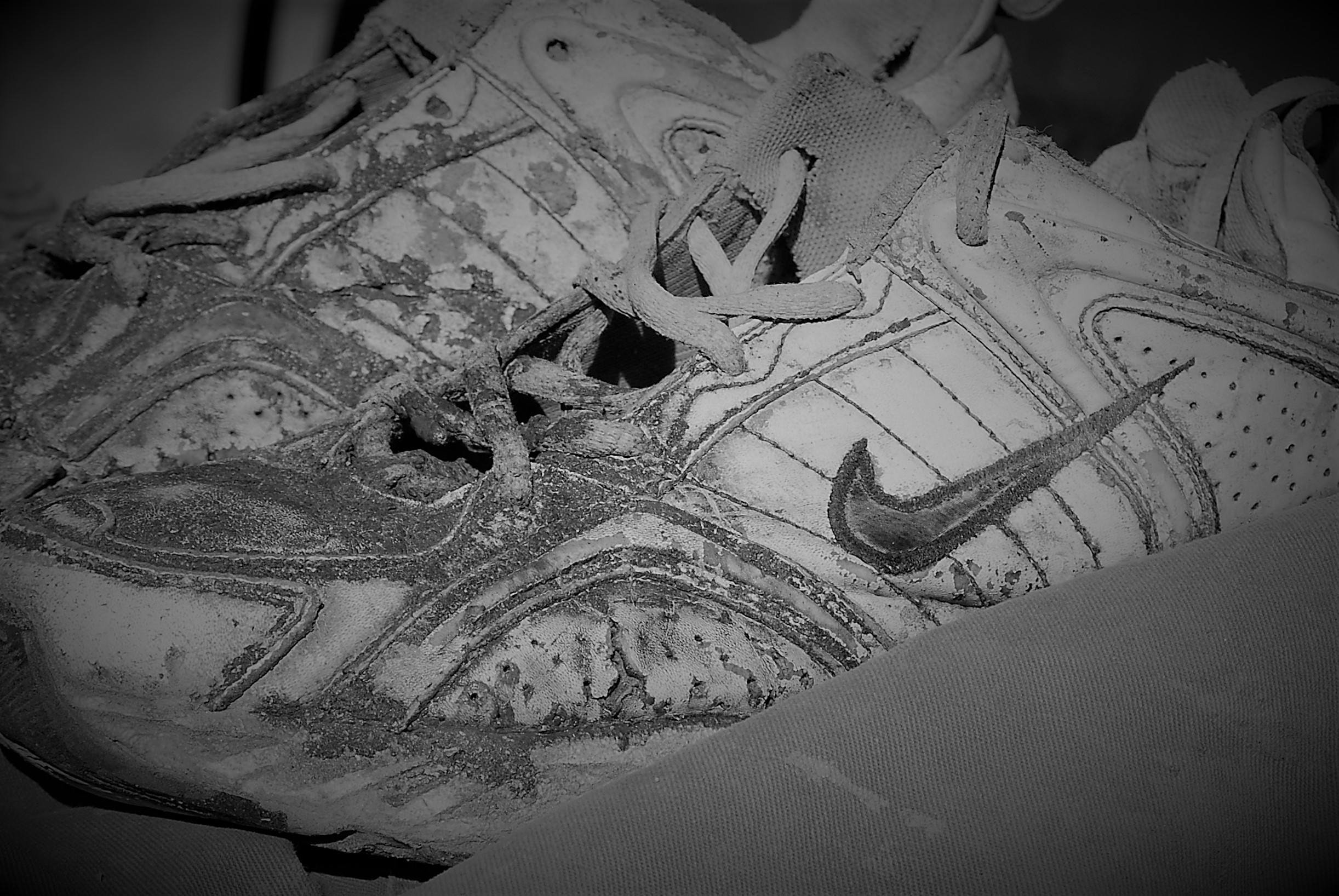 Free stock photo of Old Shoes Black White Worn Nike Running Shoes